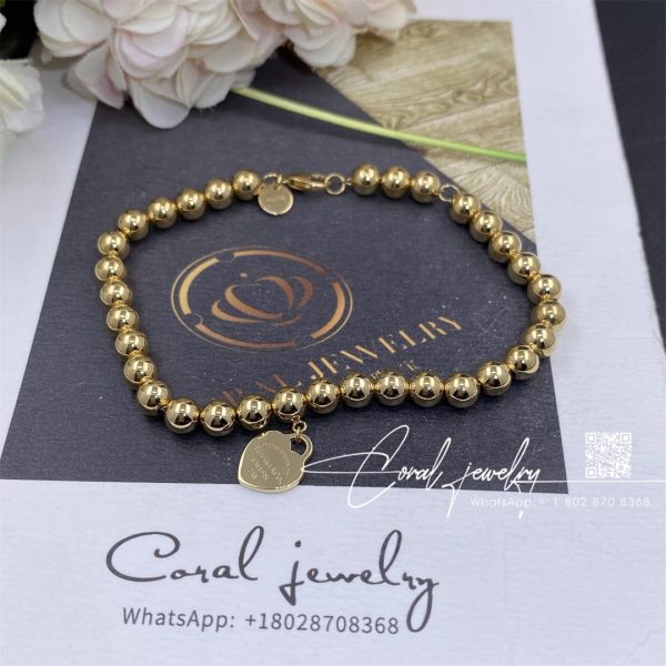 Return to tiffany® heart tag bead bracelet in yellow gold 4 mm (1)
